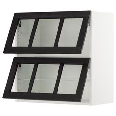 two black and white shelves with glass doors