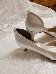 "THIS LISTING IS FOR: US Size 8W Ivory, as shown in pics is ready to ship; HEEL: 1 3/4\" INSIDE LENGHT: 9 3/4\" MEASURE YOUR FEET LENGHT TO ENSURE FIT, FINAL SALE! Wedding Peep toes satin shoes! Hand embellished with a beautiful set of Crystals brooches Please look at the pictures for details! Heel hight in the picture is: 1 3/4'' inches, OTHER SIZES AVAILABLE: COLORS OF SHOES: WHITE, IVORY, OFF-WHITE, CHAMPAGNE COLORS OF JEWELRY: GOLD, OR SILVER To order color samples: www.etsy.com/listing/1297 Elegant Fitted Kitten Heels With Low Heel, Elegant Cream Kitten Heels For Wedding, Elegant White Kitten Heels, Vintage White Heels For Wedding, Elegant Cream Kitten Heels With Closed Toe, Elegant Cream Closed Toe Kitten Heels, Classic Cream Almond Toe Wedding Shoes, Elegant Fitted Low Heel Wedding Shoes, Classic Cream Heels For Wedding