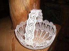 a white doily sitting on top of a wooden table