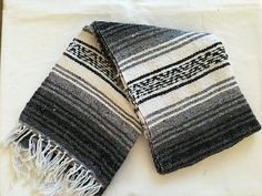 two black and white towels laying on top of each other