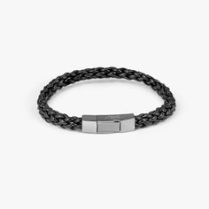 Black-coloured Italian leather strands are delicately woven together to create a textural braid and finished in a black rhodium plated sterling silver clasp, meticulously engineered in our Italian workshop. To open, simply push and hold the centre of the clasp to release the catch mechanism. Add your personal messages with our engraving service. Contact our Sloane Square boutique for further information.