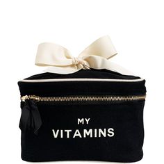 a black cosmetic bag with a white bow on the top that says my vitamins