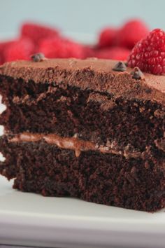 a piece of chocolate cake with raspberries on top