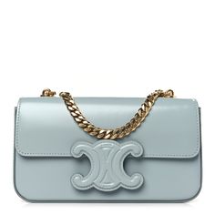 This is an authentic CELINE Shiny Calfskin Triomphe Chain Shoulder Bag in Ice Blue. This chic shoulder bag is crafted of smooth calfskin leather in blue. The bag features a gold chain strap, and a blue Triomphe snap button closure on the crossover flap that opens to a matching leather interior with a patch pocket. Cuir Triomphe, Celine Box, Bag Light, Big Bags, Chain Shoulder Bag, Black Cross Body Bag, Flap Bag, Leather Interior, Ice Blue