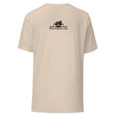 the back of a beige shirt with black and white logo on it