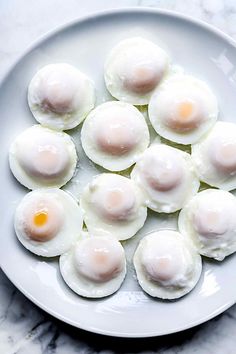 eggs are arranged on a white plate