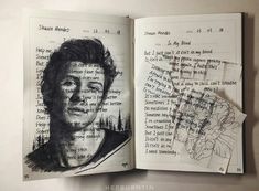 an open book with a drawing of a man's face and bird on it