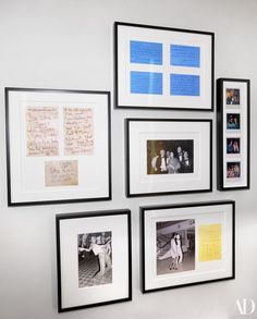 several framed photographs hang on the wall