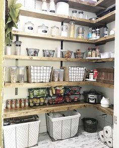 an organized pantry with baskets and food items