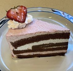 a piece of chocolate cake with a strawberry on top