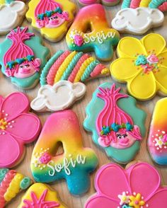 some decorated cookies are laying on a table