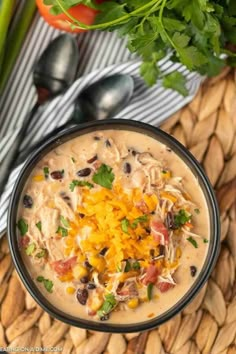 an image of a bowl of quesadilla soup with cheese and black beans