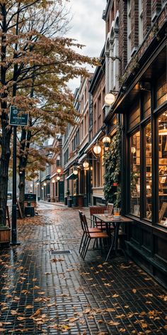 an empty street with tables and chairs on it