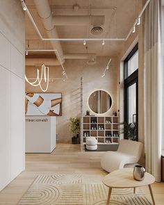 a living room filled with furniture and a large mirror on the wall next to a window