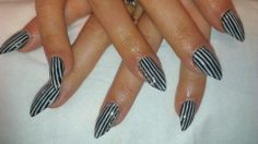 Stiletto black and white striped nails Striped Nails Black And White, White Nails With Black Stripes, Vertical Stripe Nails, Red And White Striped Nails, Black And White Stripe Nails, Striped Acrylic Nails, Stripe Acrylic Nails, White Striped Nails, Sporty Nails