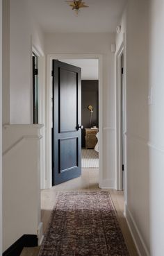 the hallway is clean and ready to be used as an entrance way for someone's home