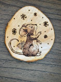 a wooden plate with a mouse on it