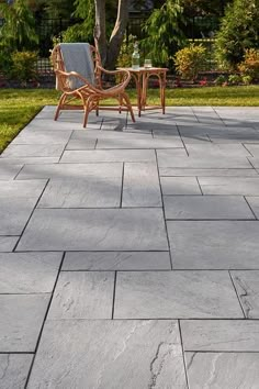 an outdoor patio area with chairs and table