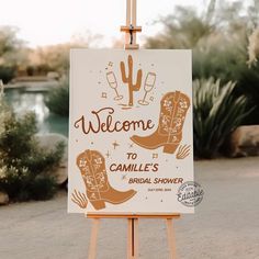 an easel with a sign that says welcome to danielle's bridal shower