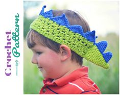 a young boy wearing a crocheted green and blue headband