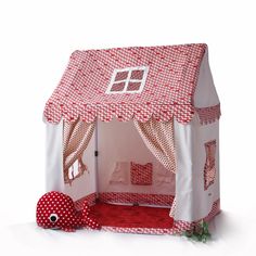 a red and white tent with polka dots on it