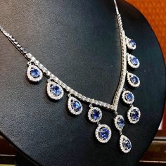 Stunning! Just one word! Stunning! 20.22 total carat weight Blue Sapphire & Diamonds in 18K solid white gold necklace & earrings set! With 16 pieces of CLEAN, sparkling Ceylon Blue Sapphires. Surrounded by 310 pieces of F/VS, natural diamonds, weighting a total of 7.81 carats, handcrafted in TIMELESSLY BEAUTIFUL, and exquisite 18K WHITE GOLD NECKLACE AND EARRINGS! Special! Jewelry from direct manufacturer at wholesale price! SUGGESTED RETAIL VALUE: $38,900   BLUE SAPPHIRES: Necklace: 12 Luxury Blue Diamond Cut Necklace, Luxury Tanzanite Necklace With Brilliant Cut, Luxury Sapphire Diamond Pendant Necklace, Luxury Sapphire Drop Jewelry, Fine Jewelry Sapphire Drop Necklace, Luxury Pear-shaped Sapphire Jewelry, Luxury Tanzanite Necklace For Anniversary, Diamond Drop Necklace With Gemstone, Luxury Tanzanite Necklaces For Anniversary