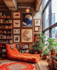 a living room filled with lots of books and furniture next to a window covered in pictures