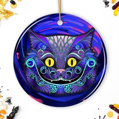 a halloween ornament with an image of a cat's face on it