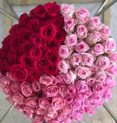 two large bouquets of pink and red roses