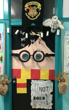 harry potter door decorating the school's classroom with his hat and wands