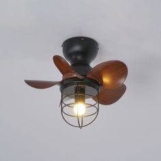 a ceiling fan with wooden blades and a light bulb