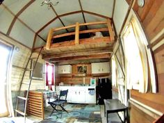 the interior of a tiny house with loft