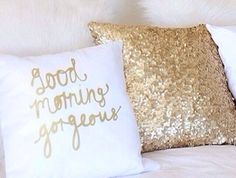 two pillows that have gold sequins on them, one with good morning gorgeous written on it