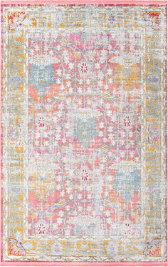 an area rug with various colors and patterns on the floor, including pink, blue, yellow