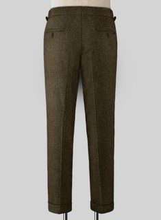 Wish you had an alternative to the countless charcoal grey and navy pants you continually wear to work, social events and weddings? Look no further than our Bottle Brown Herringbone Highland Tweed Trousers. Crafted from wool, these brown trousers feature a herringbone pattern that brings a breath of fresh air into it, while the tweed fabric makes it a perfect choice for wintry weather. 
 
 Look Includes  Bottle Brown Herringbone Tweed Fabric  Cross Pocket  Forward 2 Pleats  Side Tabs (No Loops)- Grey Tweed Suit, Herringbone Tweed Jacket, White Linen Suit, Green Velvet Jacket, Peaky Blinders Suit, Royal Blue Suit, Fabric Cross, Tweed Trousers, Brown Trousers