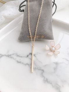 "・All items are lovingly handcrafted made to order. :) ・All metal components are 14K gold filled. ・Very light weight and comfortable to wear everyday. ・The charm length is 3.8cm, thickness of the bar is 2mm. ・Chain length：14''(36cm) choker, 16''(40cm), 18\"(45cm) or 20''(50cm). if you want different length, please contact me! :) ♥︎Gold filled jewelry is hypoallergenic, waterproof and will not wear off or chip over time. (although we suggest taking them off before showering, sleeping etc for maxi Minimalist 14k Gold Filled Bar Necklace Gift, Minimalist 14k Gold Filled Bar Necklace For Gift, Minimalist Gold Bar Necklace As Gift, Minimalist Gold Bar Necklace For Gift, Simple Gold Bar Necklace For Gift, Simple Gold Bar Necklace With Delicate Chain, Grey Ribbon, Layered Necklace Set, Gold Bar Necklace