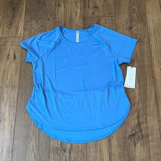 Nwt Woman’s Blue Rbx, Short Sleeve, Athletic Top With Wicking To Pull Moisture Away From Skin In A Size Large. Blue Moisture-wicking T-shirt For Spring, Spring Blue Moisture-wicking T-shirt, Blue Workout T-shirt For Spring, Blue Short Sleeve Activewear For Spring, Blue Casual Crew Neck Activewear, Blue Short Sleeve Activewear For Workout, Basic Blue Activewear For Workout, Blue Relaxed Fit Athleisure Top, Blue Relaxed Fit Workout T-shirt