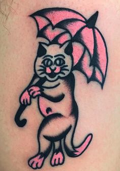 a cat with an umbrella tattoo on its back