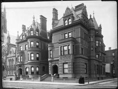 an old black and white photo of a large building with lots of windows on it