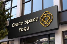 the sign for grace space yoga in front of a building