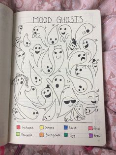 an open book with drawings in it on a pink bed sheet and the words mood ghosts