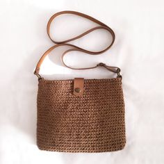 Trendy and modern crochet bag DETAILS Material: Textile yarn 80% cotton 20% polyester Dimensions: 23×18.5×2.5 cm (9''x7.25''x1'') Color brown With leather lid, long leather straps 120cm (47'') Metal color bronze With inner lining Additional information on care Washable at 30o Dry on a horizontal surface Don't tweak or twist All bags are made in a smoke and pet free room. Please note that colors may vary slightly from photos due to different monitor settings. Knitting Purses Handbags, Daily Use Brown Crochet Bag With Woven Leather, Brown Woven Leather Crochet Bag For Daily Use, Brown Leather Woven Crochet Bag For Daily Use, Casual Crochet Satchel Bag With Woven Leather, Everyday Rectangular Crochet Bag With Woven Leather, Bohemian Woven Leather Crochet Shoulder Bag, Beige Crochet Bag With Woven Leather For Everyday, Casual Crochet Shoulder Bag With Woven Leather