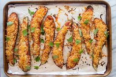 baked stuffed eggplant with parmesan and herbs on a baking sheet, ready to be eaten