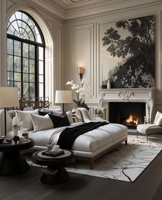 a living room filled with furniture and a fire place in front of a painting on the wall