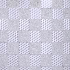 a white and silver checkered wallpaper with metallic glitters on it's surface