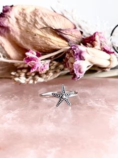 Single Starfish Ring: -Solid .925 sterling silver -Starfish measures 11mm x 11 mm -Ring band measures 1.2mm wide -Available in US sizes 4-10.5 with half sizes Connect with us on Instagram @a_wild_violet for sales and giveaways! **All items are in stock and ship within 2-5 business days from received payment (excluding Saturday/Sunday) from the US. If you are within the US please expect 3-7 business days for shipping transit and delivery. International orders please expect a minimum of 2 weeks fo Knuckle Rings Silver, Starfish Ring, Beach Rings, Ocean Ring, Stella Marina, Knuckle Ring, Silver Stacking Rings, Knuckle Rings, Mermaid Style