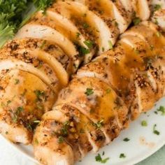 some chicken and broccoli on a white plate