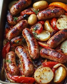 sausages, potatoes and peppers in a baking dish