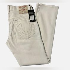 Nwt - True Religion Men's Geno Slim-Fit Optic White Jeans - Size 42 Inseam: 33” (Approx.) Length From Waist To Ankle Is 45.5” Please Note: Clothing May Have Dust Marks Or Spots That Are From In-Store Customer Handling. These Will Come Out When Washed. True Religion Jeans Men, Moto Jeans, True Religion Men, White Halter Maxi Dress, Twill Pants, True Religion Jeans, Blue Denim Jeans, Slim Jeans, True Religion