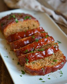 slices of meatloaf on a white plate